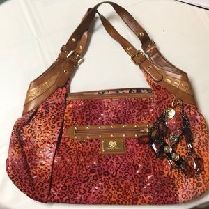 Unique cheetah-print shoulder back by Sharif